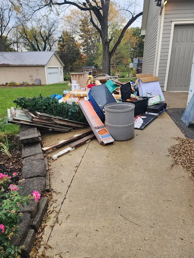 Dumpster being loaded with debris for Residential Dumpster Rental in Palmer Town